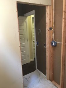 New doorway looking through to other side of half bathroom.